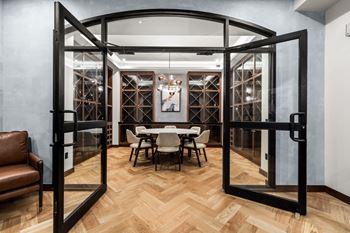 A room with a wooden floor and a glass door.
